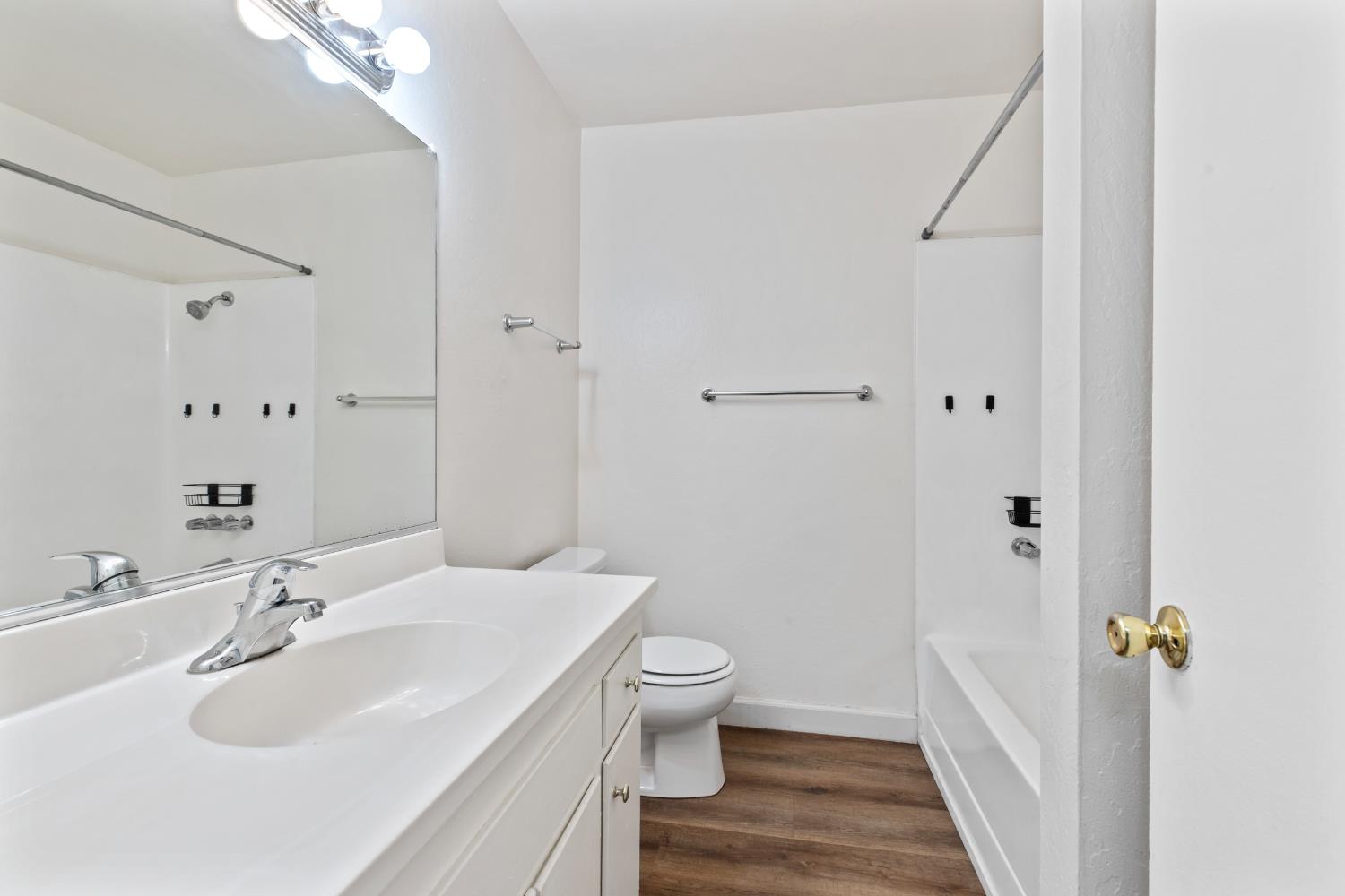 91 Summit Avenue Sonora, CA 95370 - Photo 24 of 53 a bathroom with a sink and mirror with toilet