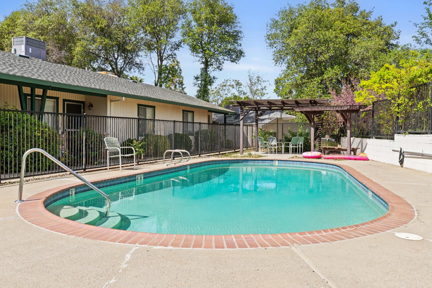 91 Summit Avenue Sonora, CA 95370 - Photo 32 of 53 a view of a swimming pool with a patio