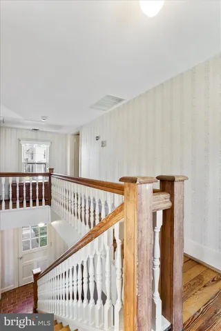 a view of an entryway with wooden floor