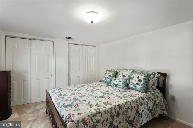 a bedroom with a bed and a cabinets