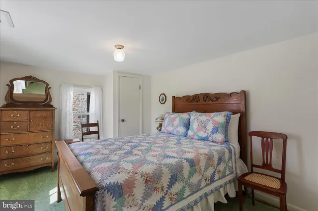 a bedroom with a bed and furniture