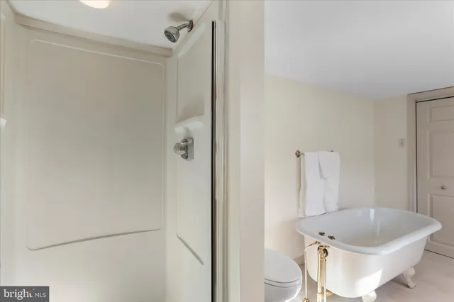 a bathroom with a tub and sink