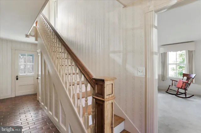 a view of a hallway with staircase