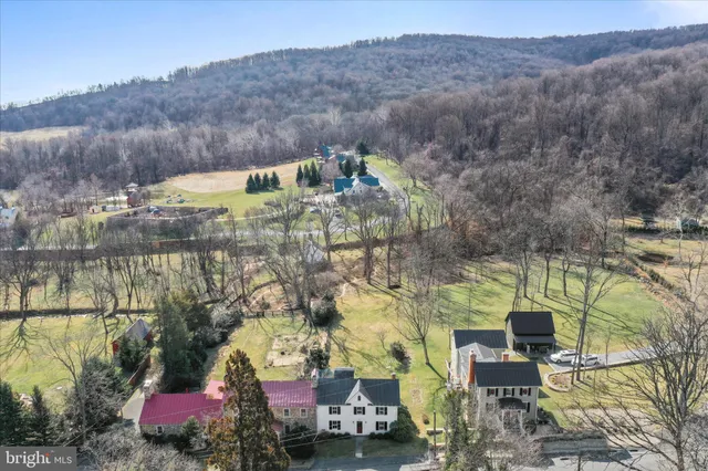 an aerial view of residential houses with outdoor space