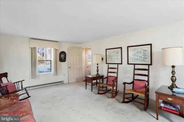 a view of a livingroom with furniture and a window