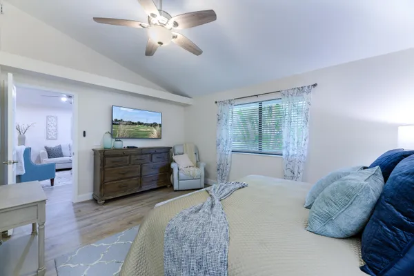 a bedroom with a bed and a dresser