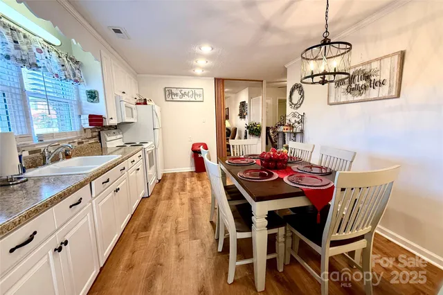 a large kitchen with a table and chairs