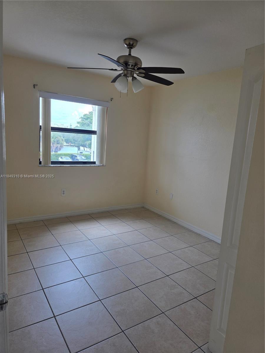 650 Palm Avenue, Unit 2B6 Hialeah, FL 33010 - Photo 11 of 12 a view of an empty room with a window