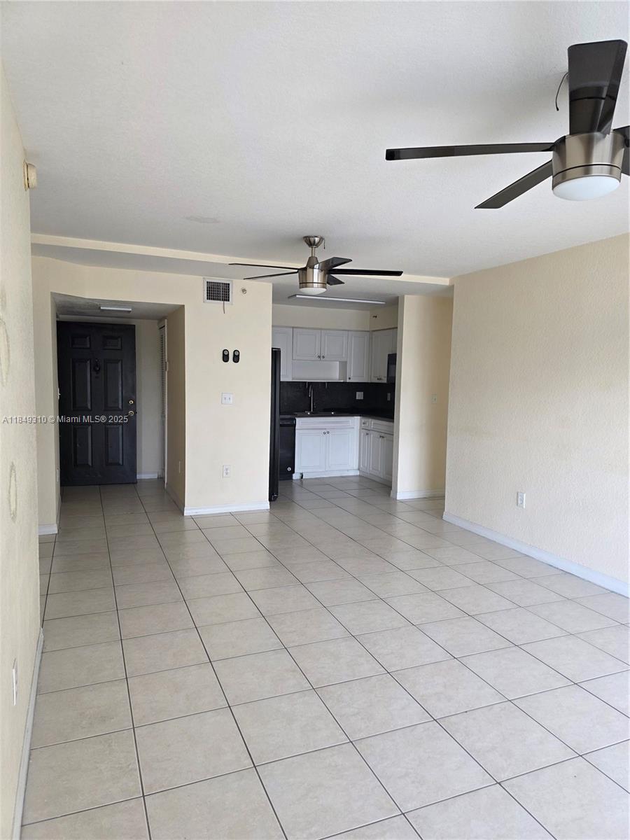 650 Palm Avenue, Unit 2B6 Hialeah, FL 33010 - Photo 4 of 12 a view of a livingroom with an empty space