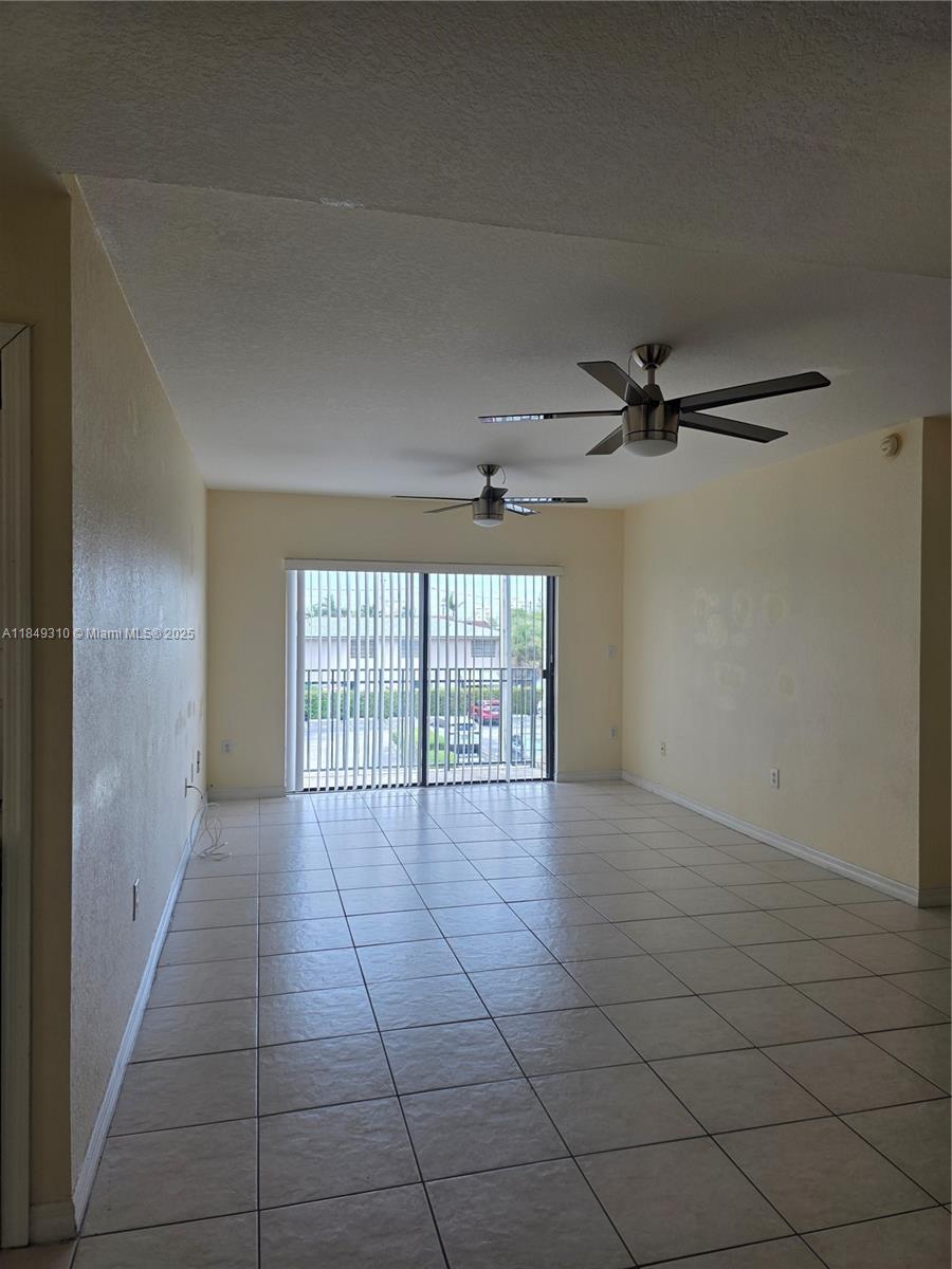 650 Palm Avenue, Unit 2B6 Hialeah, FL 33010 - Photo 6 of 12 a view of an empty room with a window