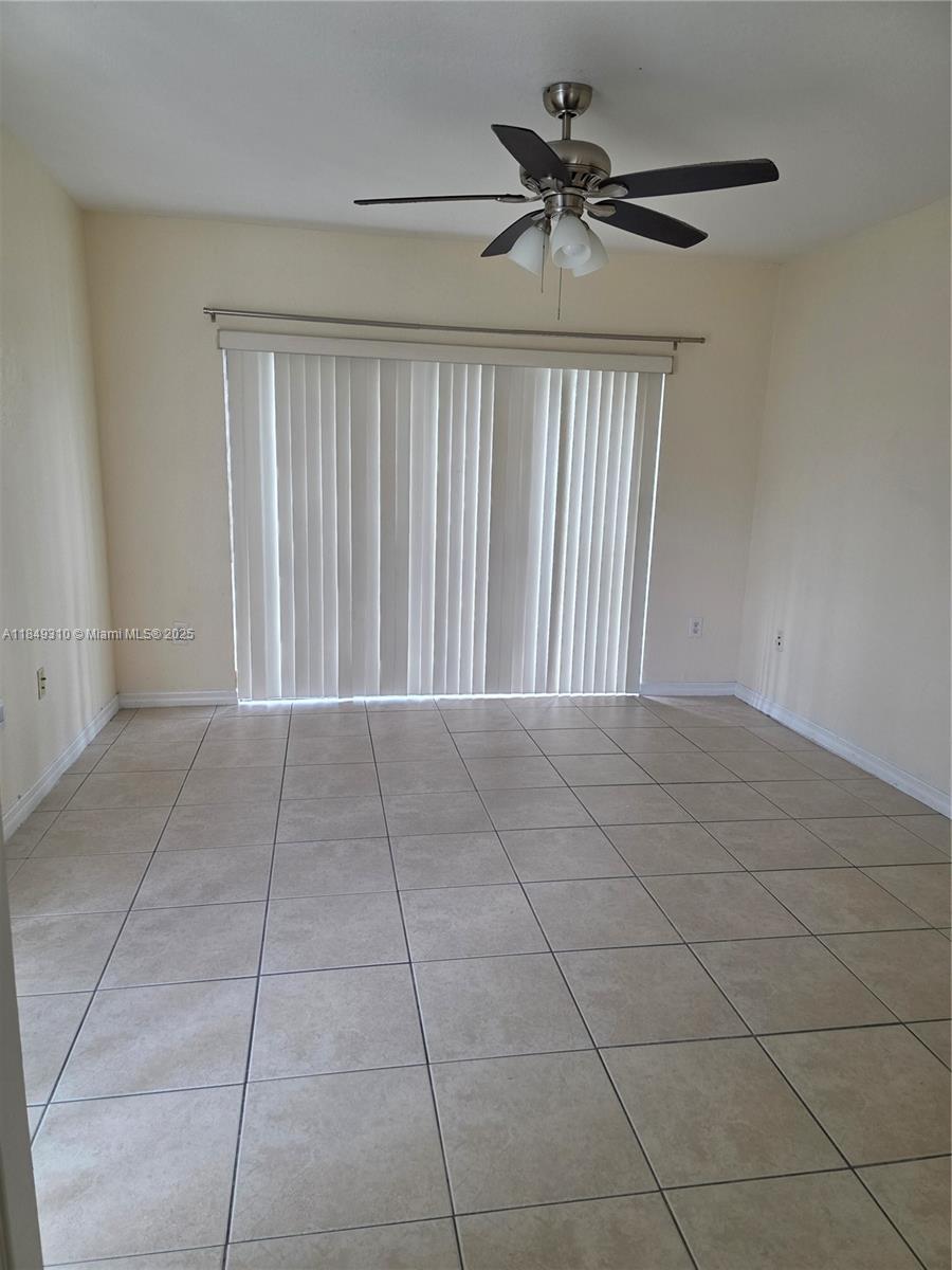 650 Palm Avenue, Unit 2B6 Hialeah, FL 33010 - Photo 9 of 12 a view of an empty room with a window