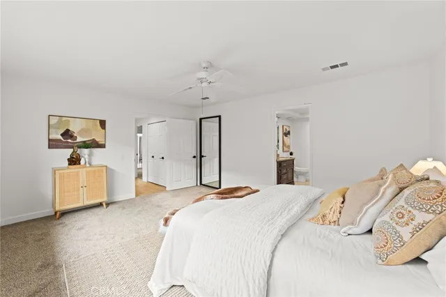 a bedroom with a bed and a table