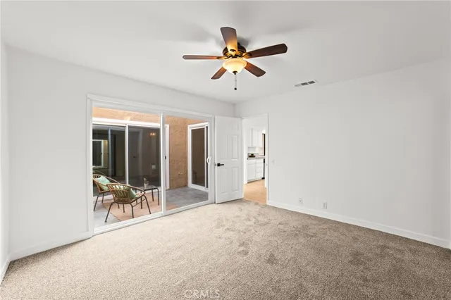 a view of livingroom with furniture and ceiling fan