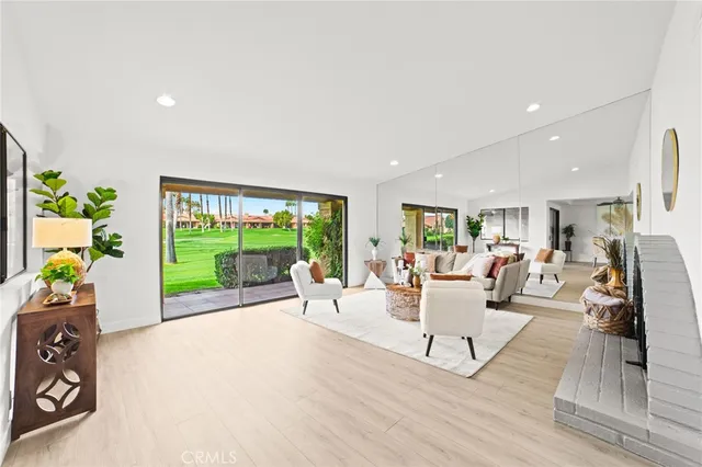 a living room with furniture and a garden