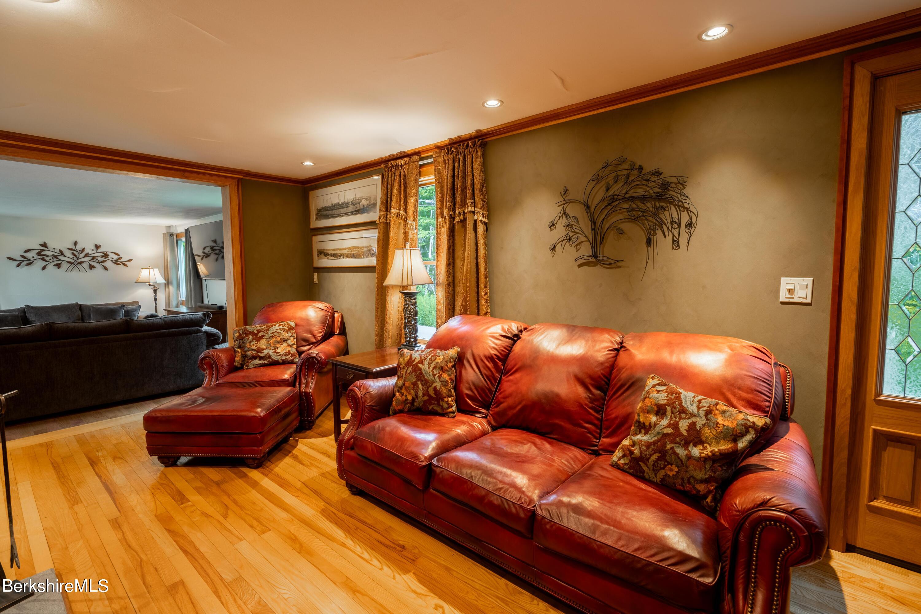 135 Ed Jones Road Otis, MA 01253 - Photo 23 of 45 a living room with furniture and a flat screen tv