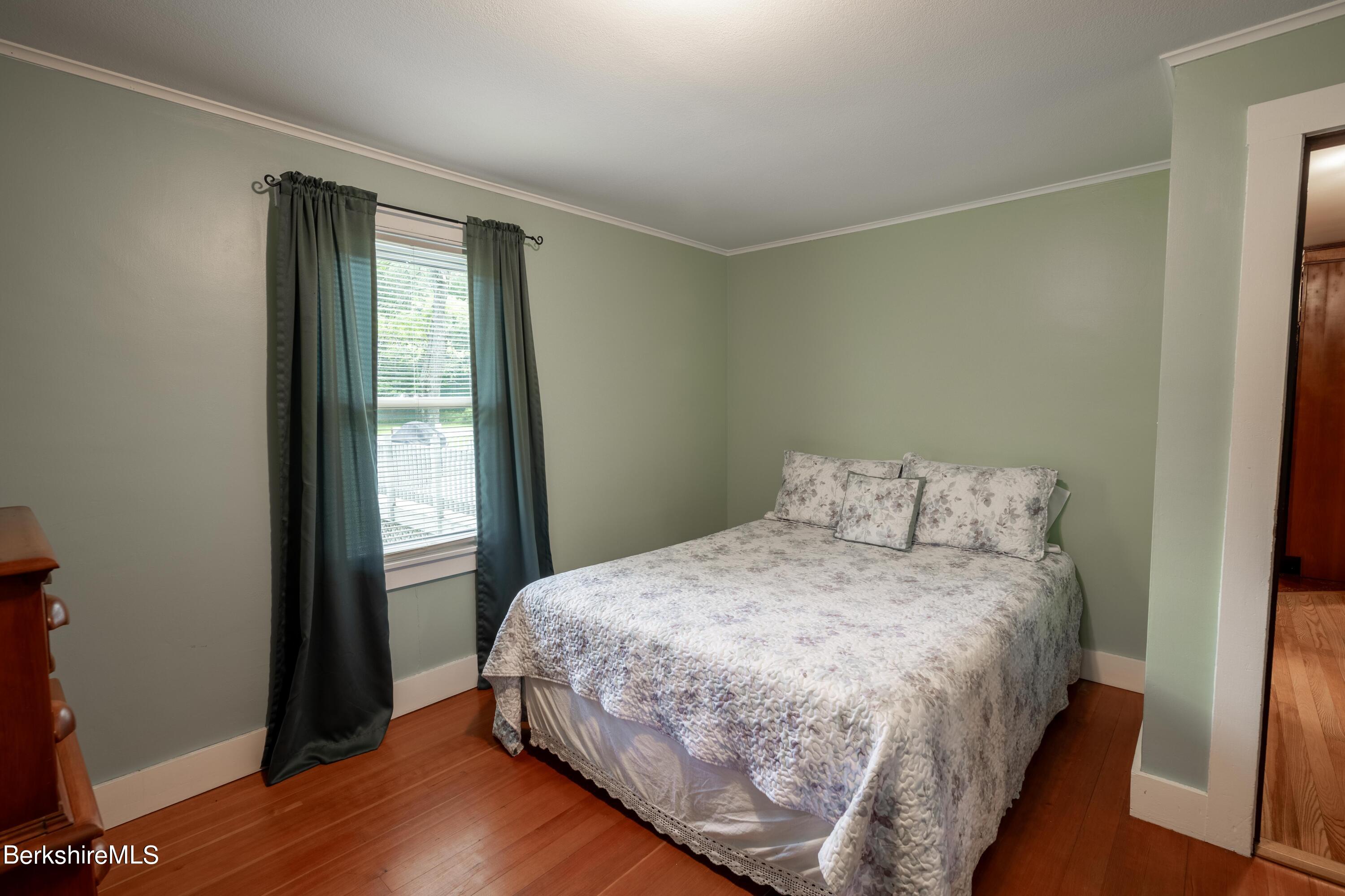 135 Ed Jones Road Otis, MA 01253 - Photo 26 of 45 a bedroom with a bed and a window