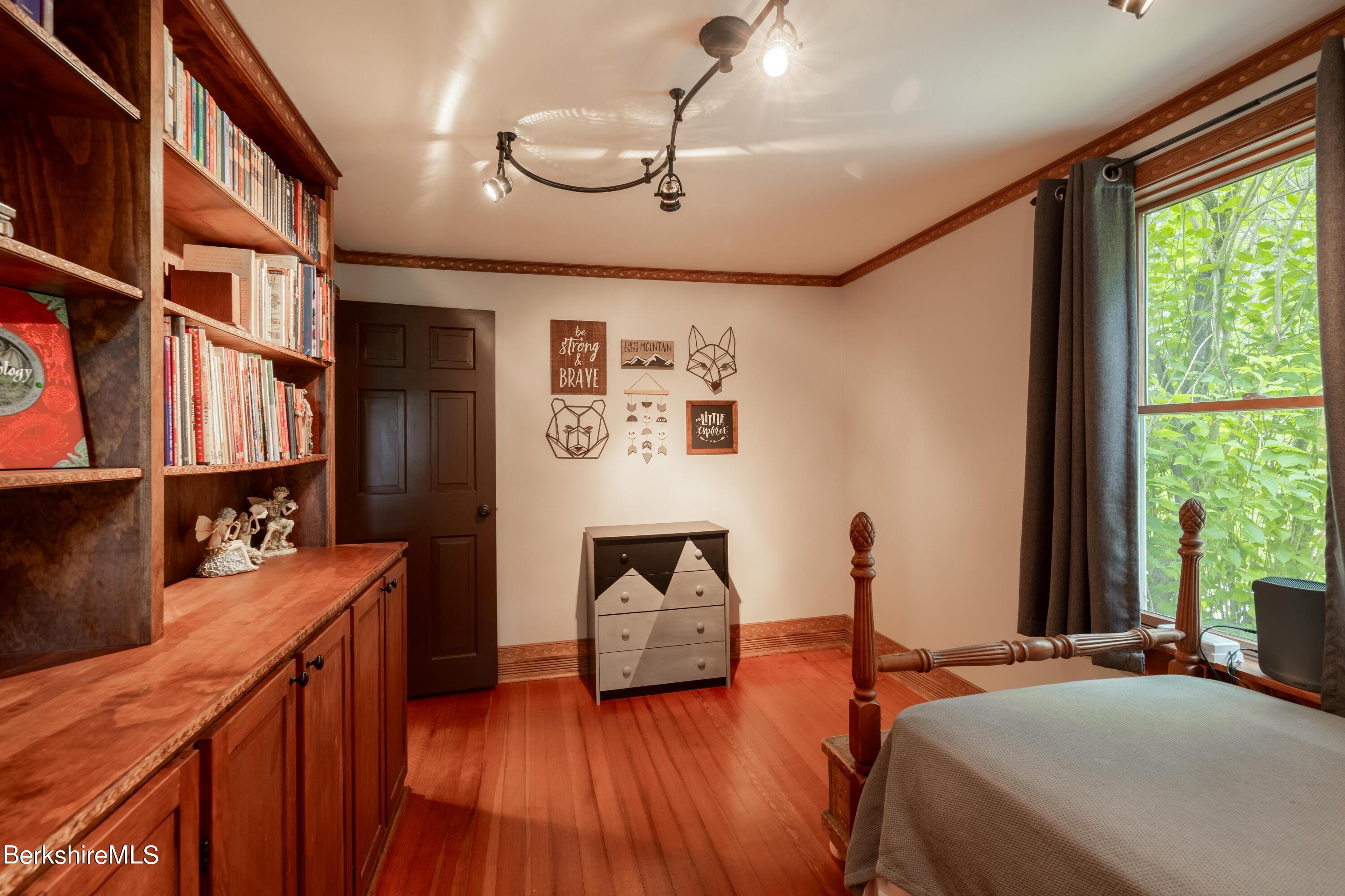 135 Ed Jones Road Otis, MA 01253 - Photo 29 of 45 a bedroom with furniture and a window