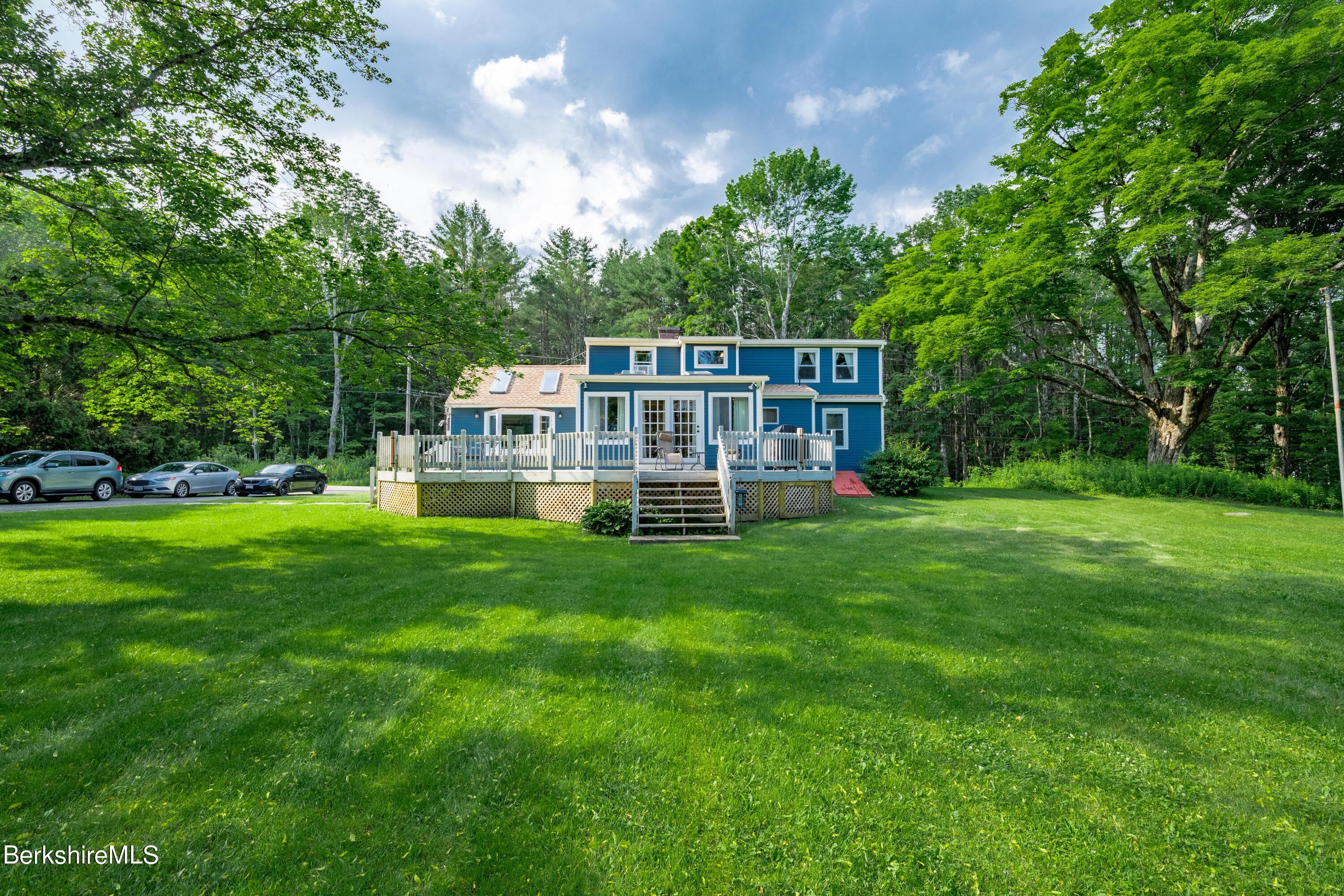 135 Ed Jones Road Otis, MA 01253 - Photo 3 of 45 a view of a house with a backyard