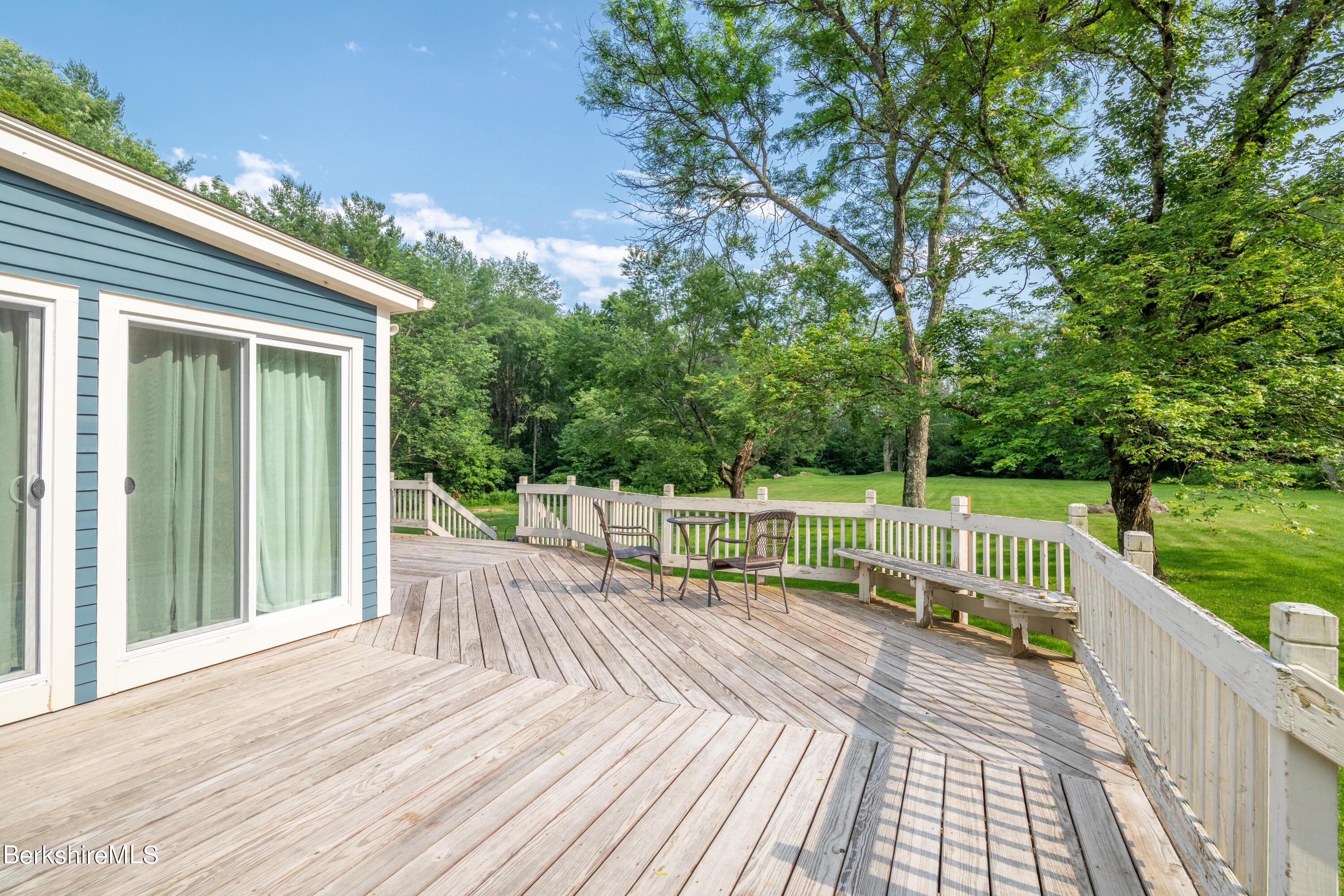 135 Ed Jones Road Otis, MA 01253 - Photo 6 of 45 a view of balcony with deck and wooden floor