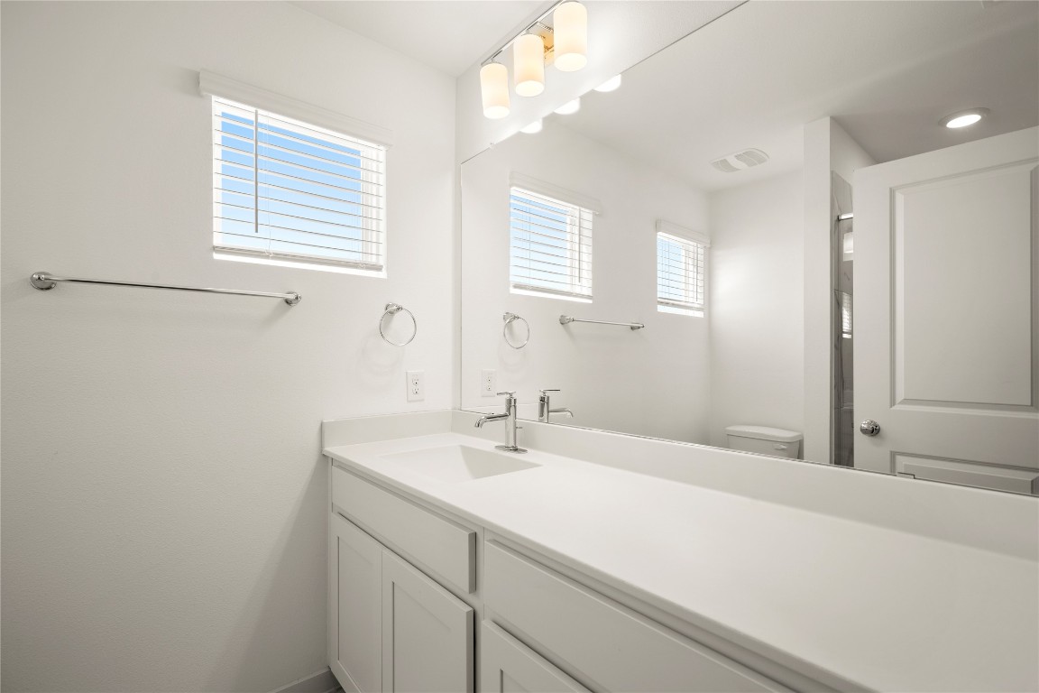15004 Ryman Road Austin, TX 78660 - Photo 17 of 23 Bathroom with vanity and toilet