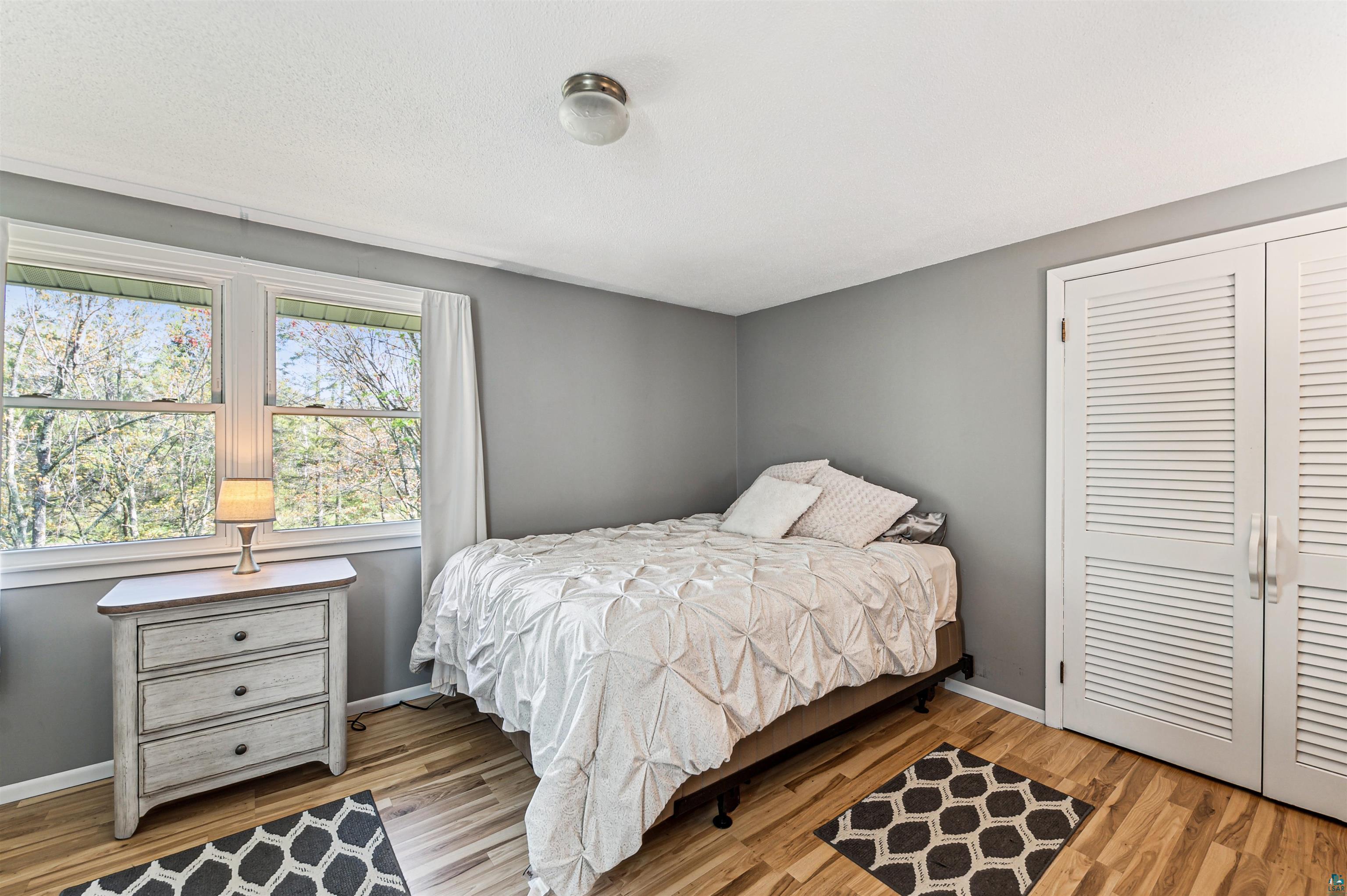 28 North Cloquet Road East Esko, MN 55733 - Photo 9 of 26 Bedroom featuring light hardwood / wood-style floors and a closet