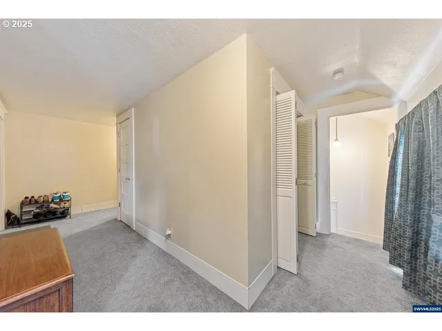 a view of hallway with a couch