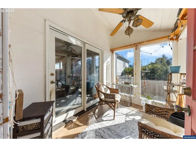 a living room with furniture a patio and a table