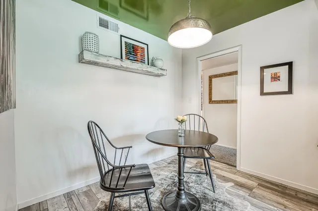 a dining room with furniture and window