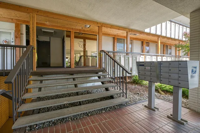 a view of a balcony with wooden floor and deck