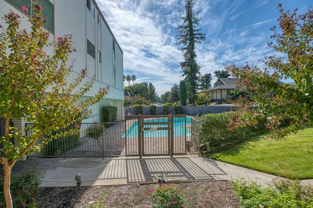 a view of a backyard with sitting area