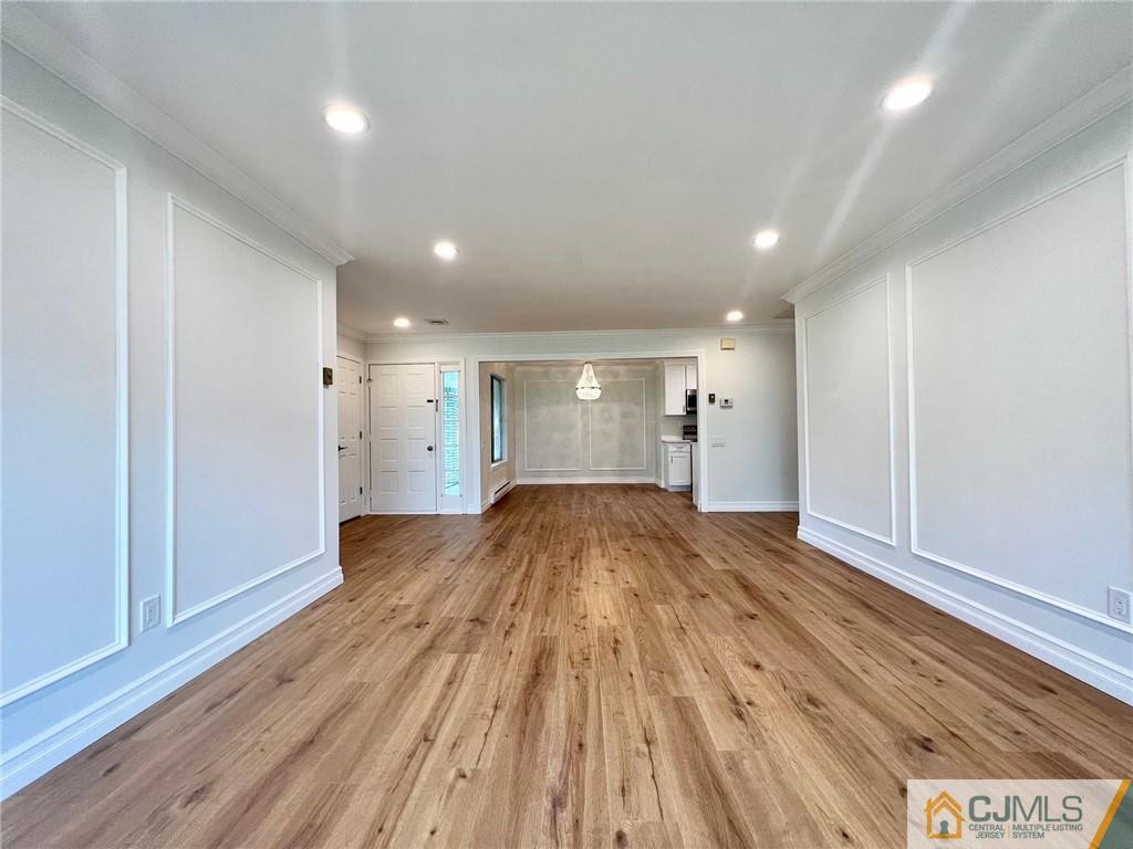 267 Glen Road, Unit 267B Monroe Township, NJ 08831 - Photo 12 of 26 a view of empty room with wooden floor