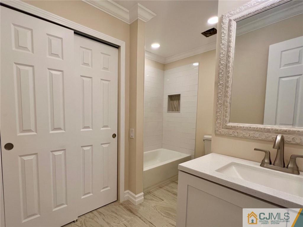 267 Glen Road, Unit 267B Monroe Township, NJ 08831 - Photo 14 of 26 a bathroom with a sink and a mirror