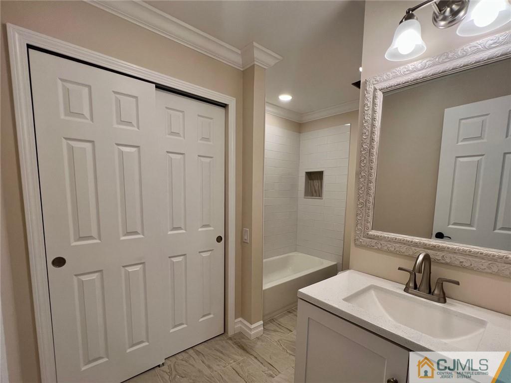 267 Glen Road, Unit 267B Monroe Township, NJ 08831 - Photo 15 of 26 a bathroom with a sink and a mirror