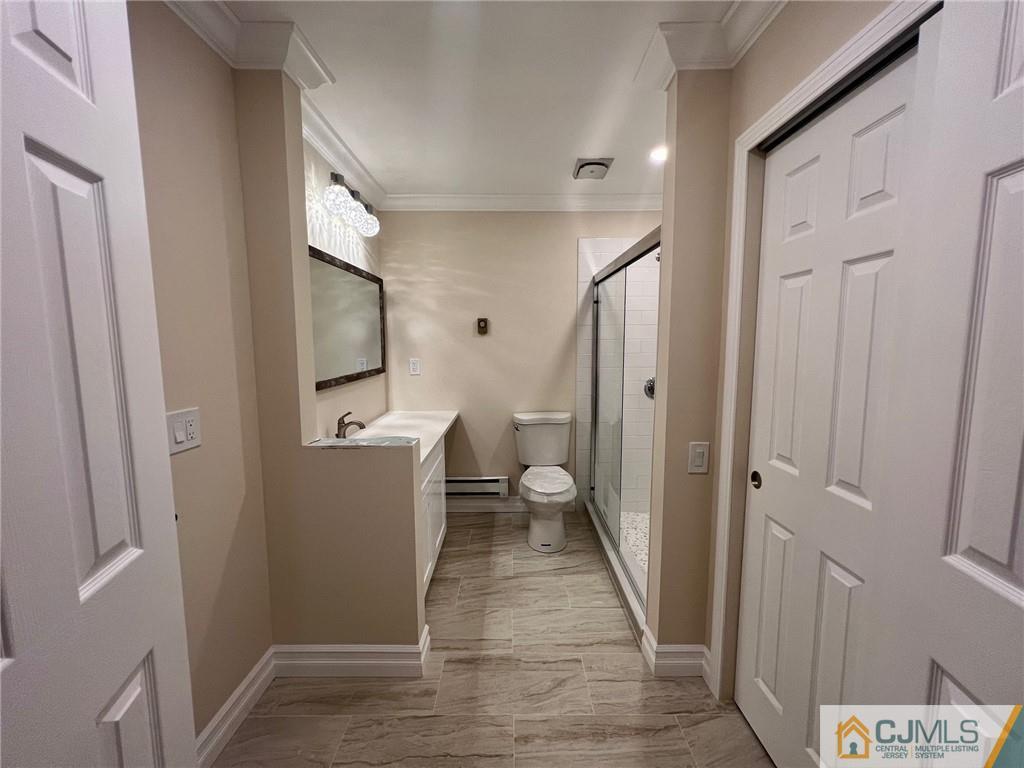 267 Glen Road, Unit 267B Monroe Township, NJ 08831 - Photo 18 of 26 a view of a hallway with bathroom and wooden floor