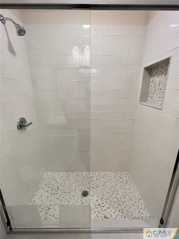 267 Glen Road, Unit 267B Monroe Township, NJ 08831 - Photo 21 of 26 a bathroom with a shower