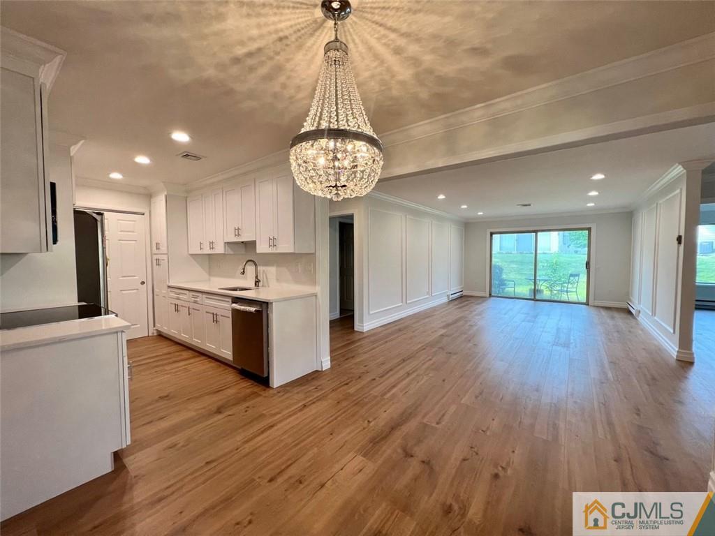 267 Glen Road, Unit 267B Monroe Township, NJ 08831 - Photo 5 of 26 a view of kitchen with stainless steel appliances granite countertop cabinets and wooden floor