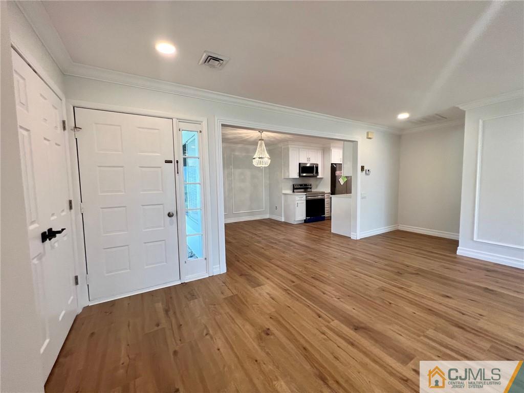 267 Glen Road, Unit 267B Monroe Township, NJ 08831 - Photo 10 of 26 a view of a kitchen with a refrigerator and a sink