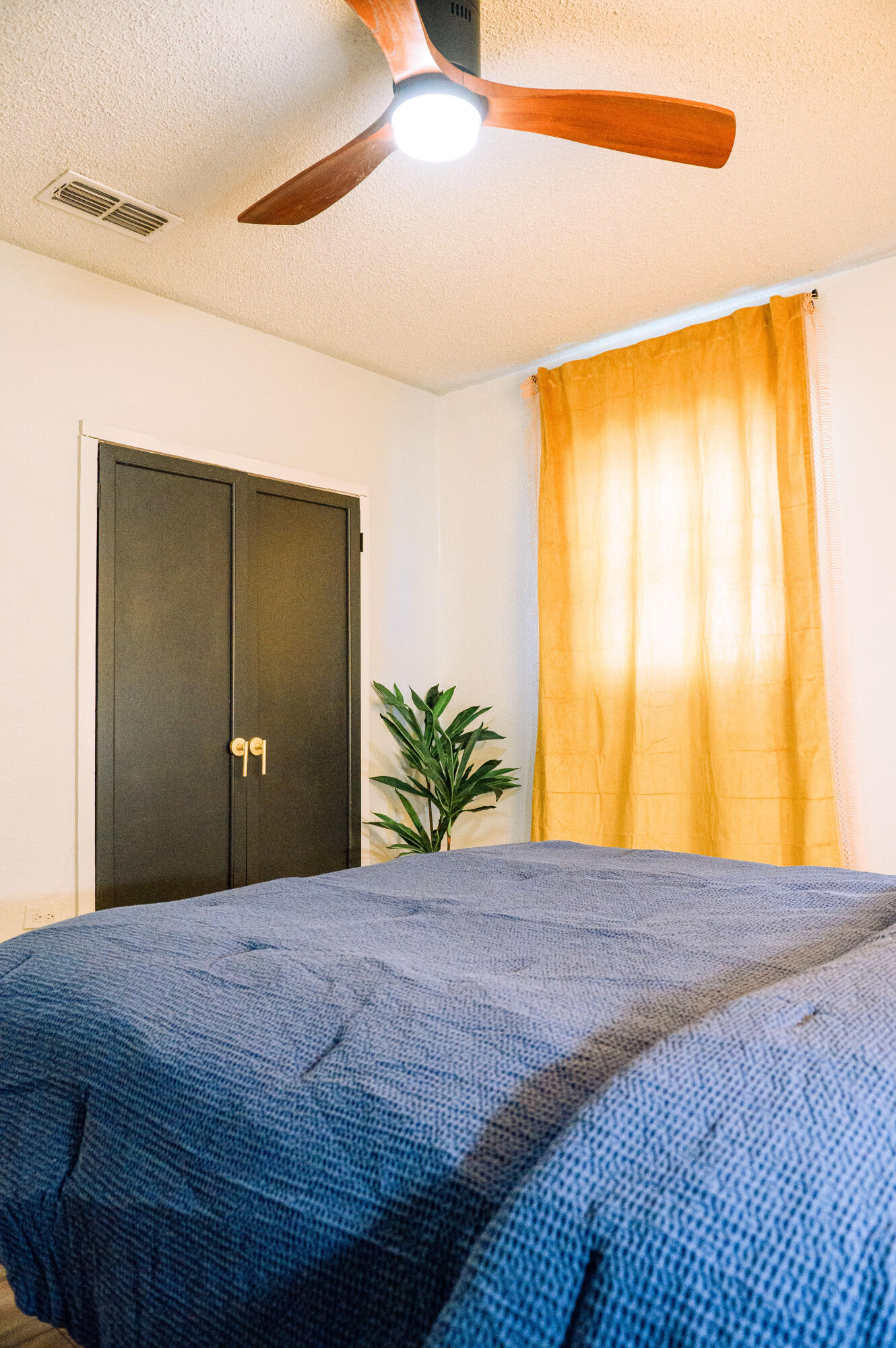 2436 24th Street Lubbock, TX 79411 - Photo 17 of 29 a bedroom with a bed and lamps