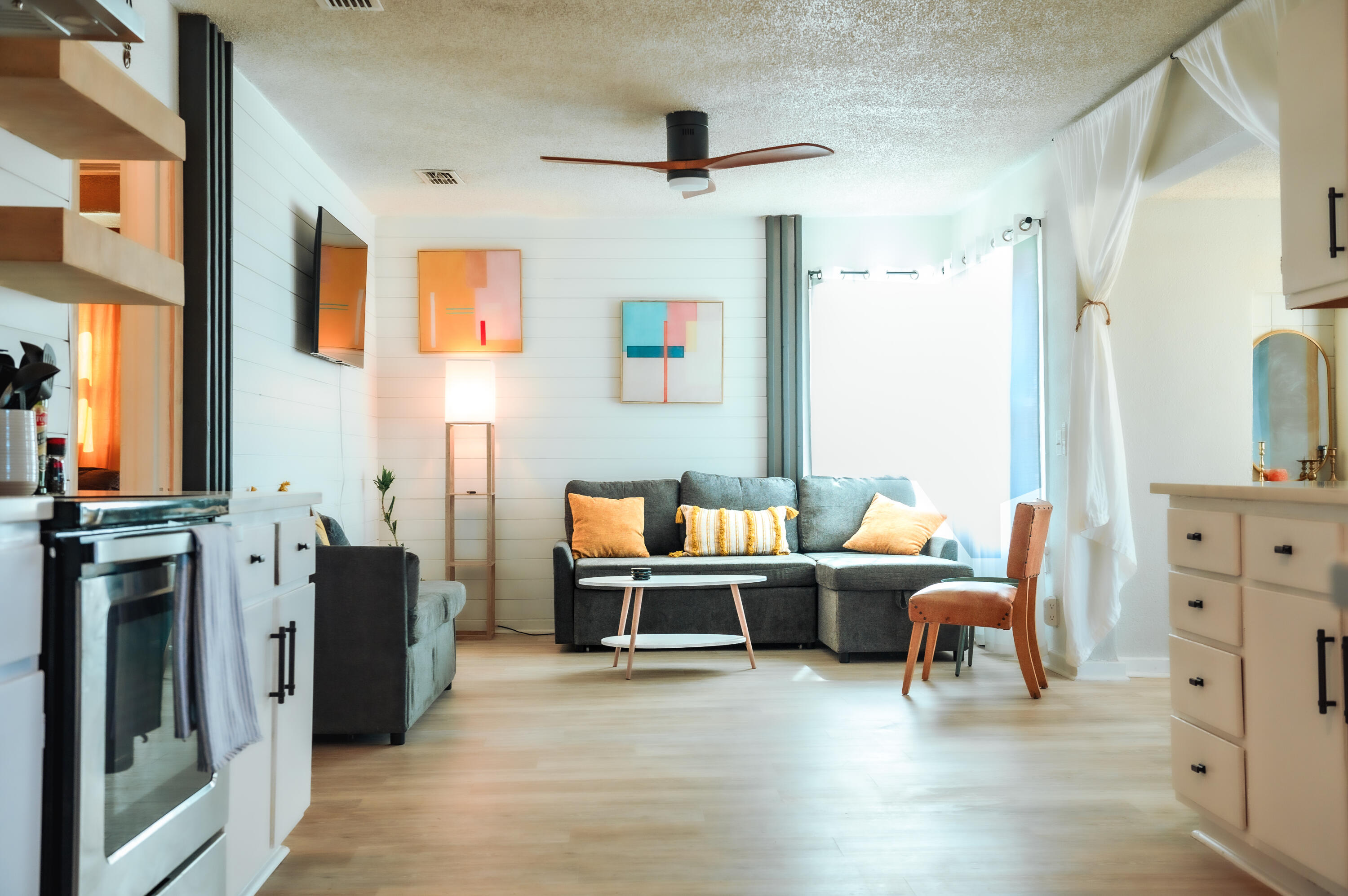 2436 24th Street Lubbock, TX 79411 - Photo 23 of 29 a living room with furniture a fireplace and a flat screen tv