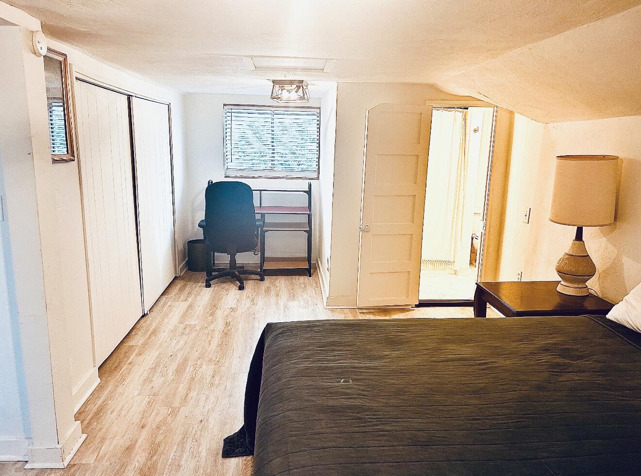 2436 24th Street Lubbock, TX 79411 - Photo 28 of 29 a very nice looking room with a large window and a bed