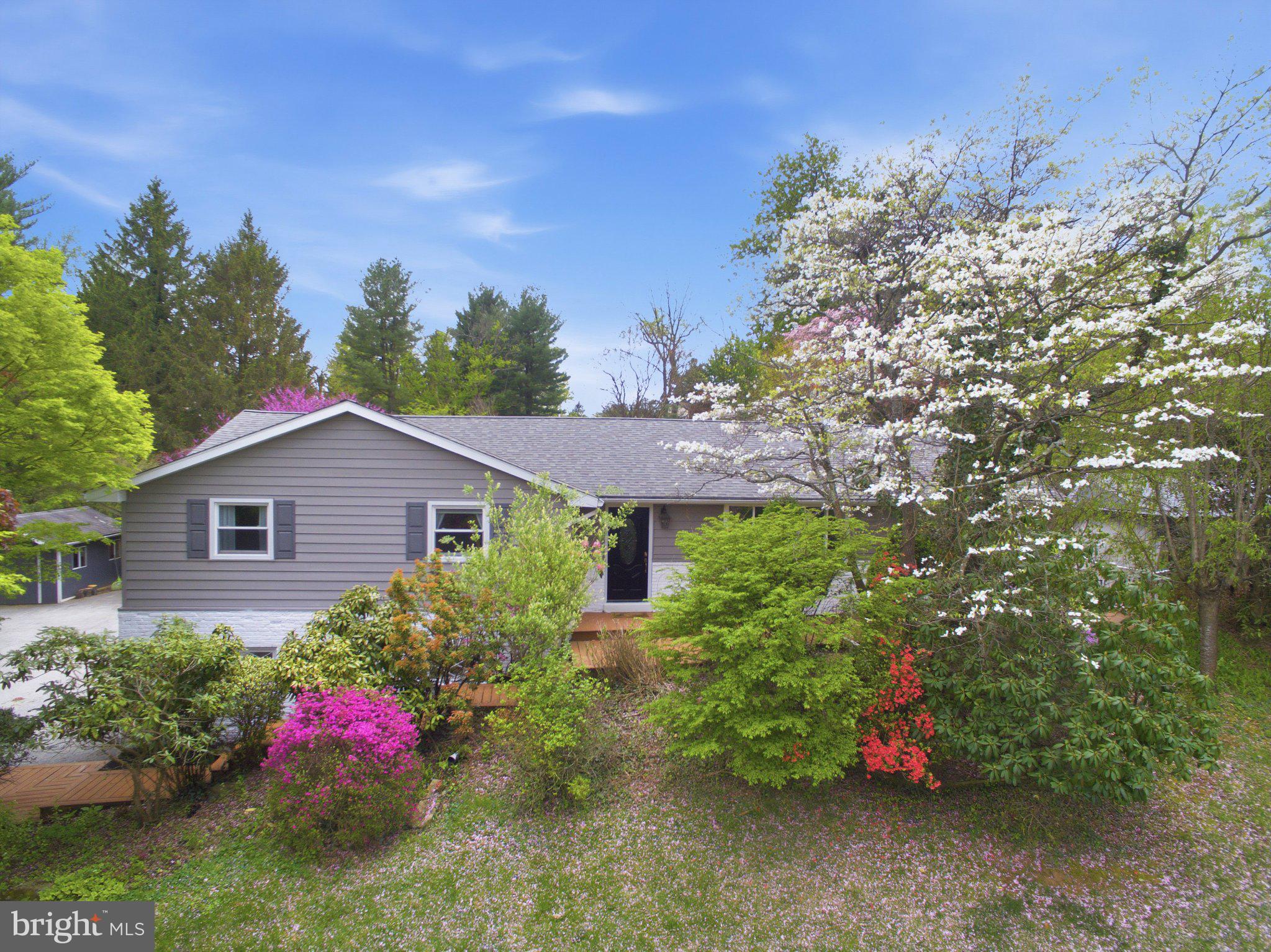3104 North Providence Road Media, PA 19063 - Photo 2 of 47 Charming home amidst vibrant blooms.