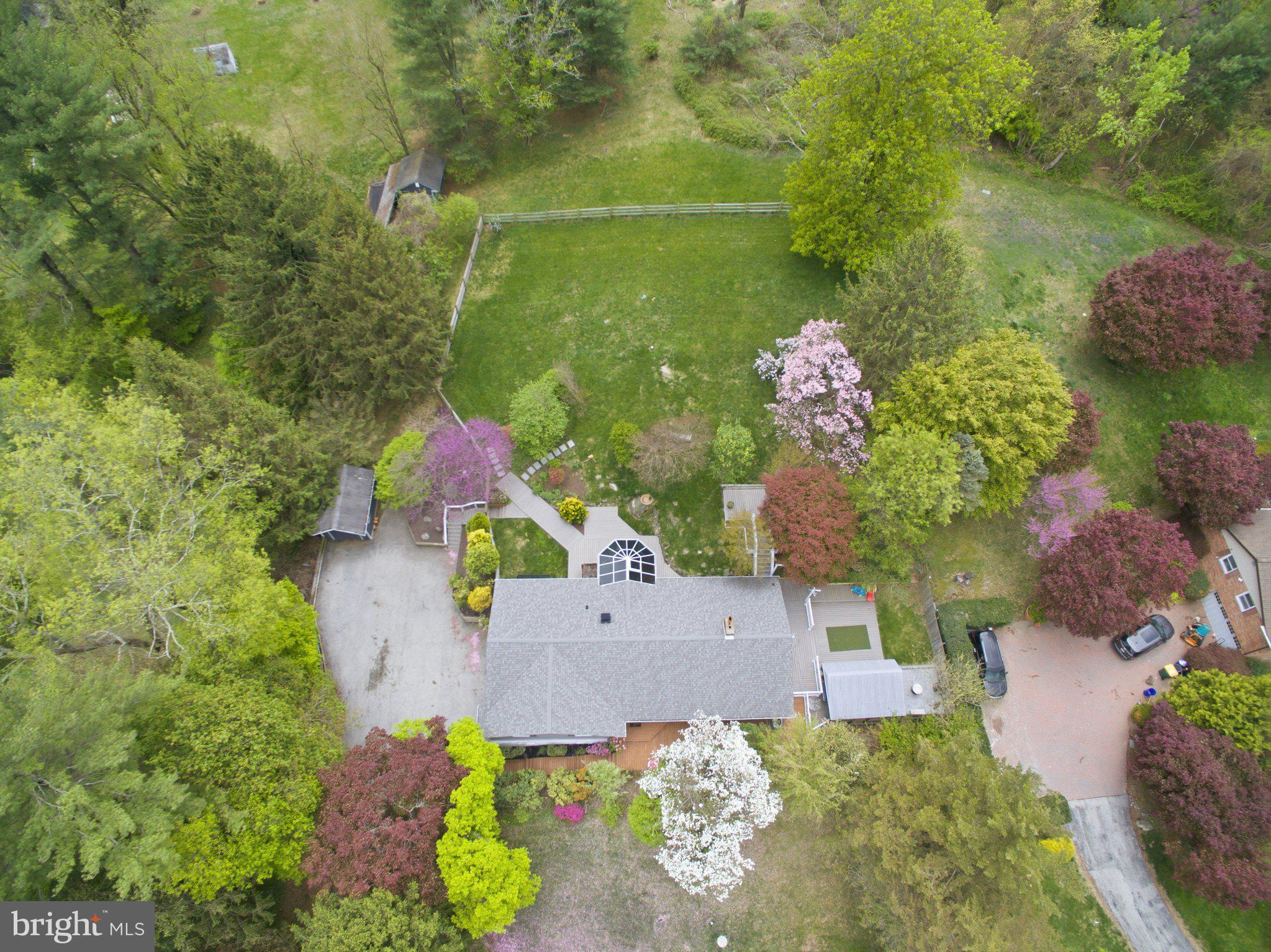 3104 North Providence Road Media, PA 19063 - Photo 5 of 47 Lush greenery surrounds a charming home.