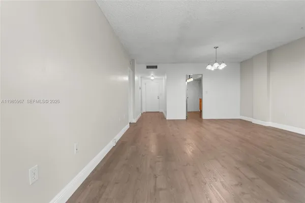 a view of a big room with wooden floor