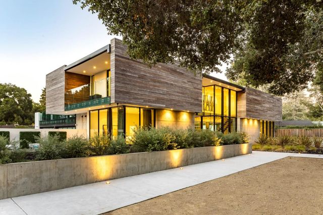a view of swimming pool with outdoor seating and plants