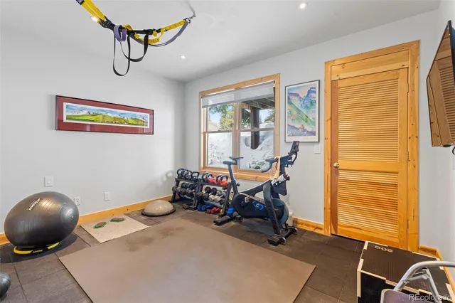 a view of a brick house with large windows