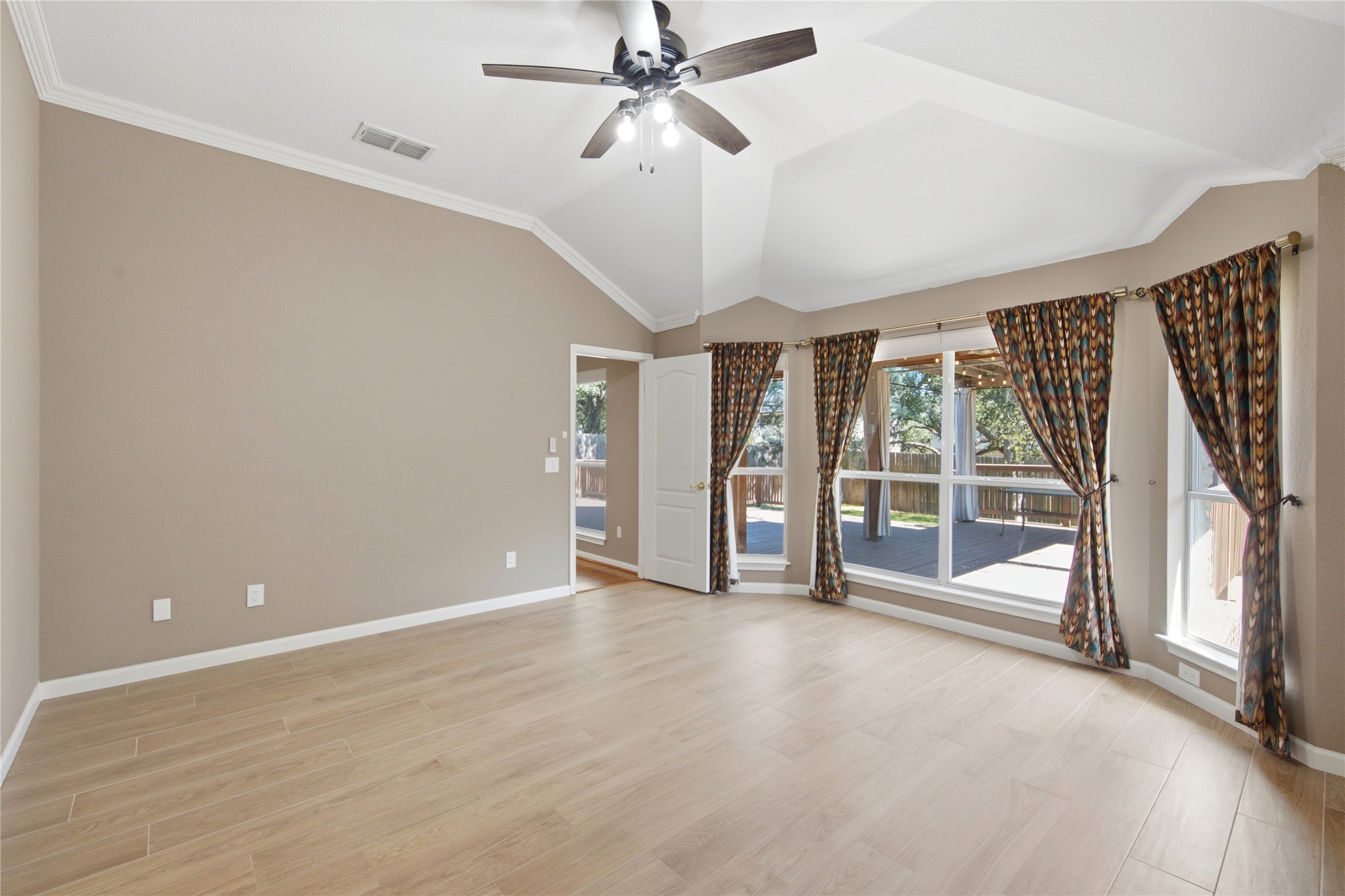 6032 Roxbury Lane Austin, TX 78739 - Photo 11 of 34 High vaulted ceilings and wood-look flooring define this versatile space.