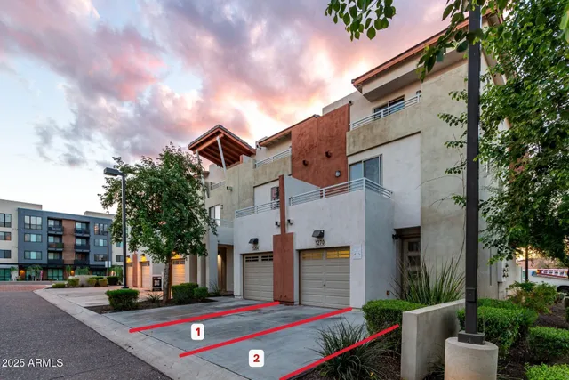 a front view of a building with garden