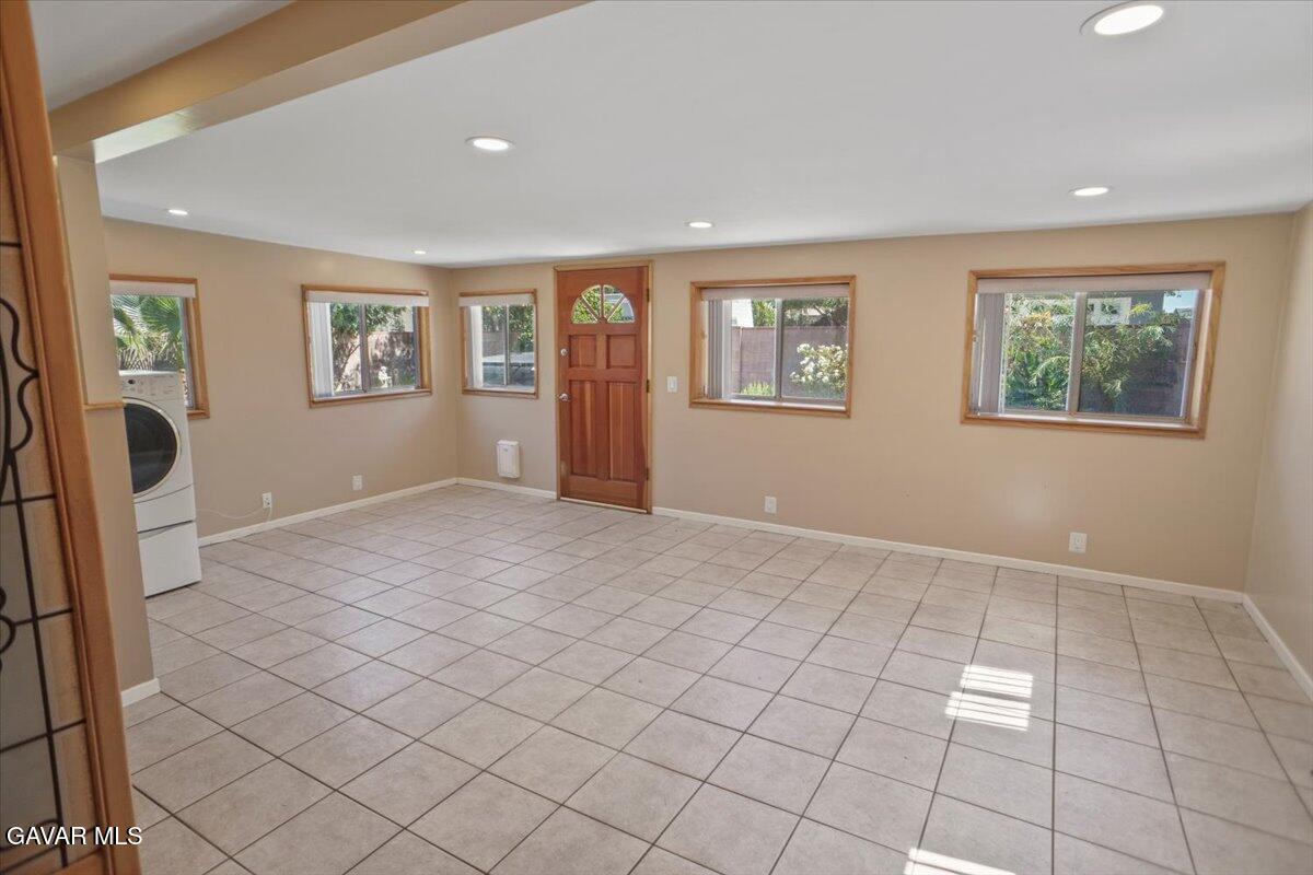 42652 55th Street West Lancaster, CA 93536 - Photo 13 of 28 a view of an empty room with window and cabinet