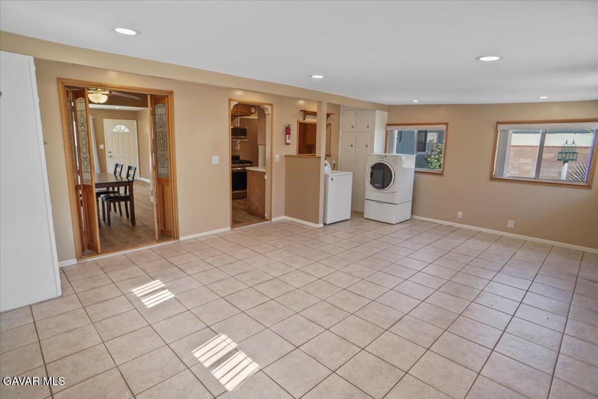 42652 55th Street West Lancaster, CA 93536 - Photo 14 of 28 a spacious bedroom with a bed and a window