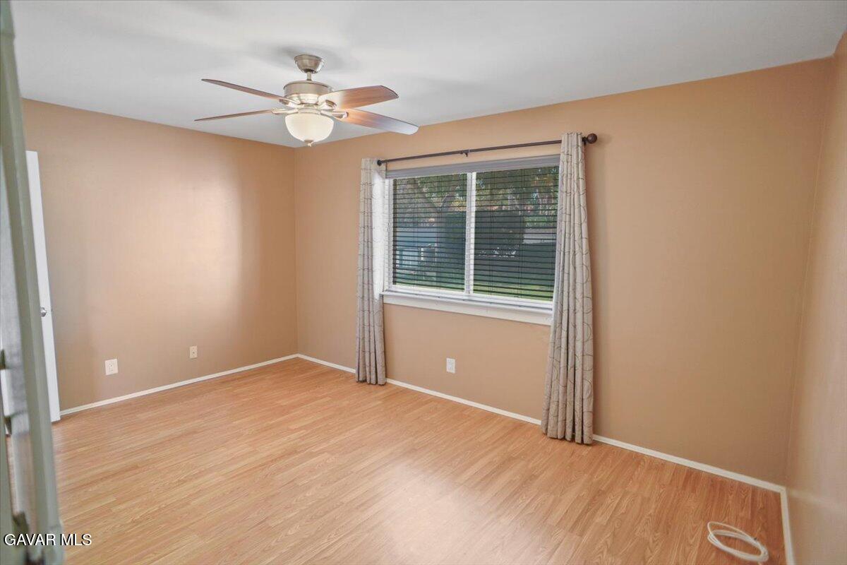 42652 55th Street West Lancaster, CA 93536 - Photo 16 of 28 a view of an empty room with a window